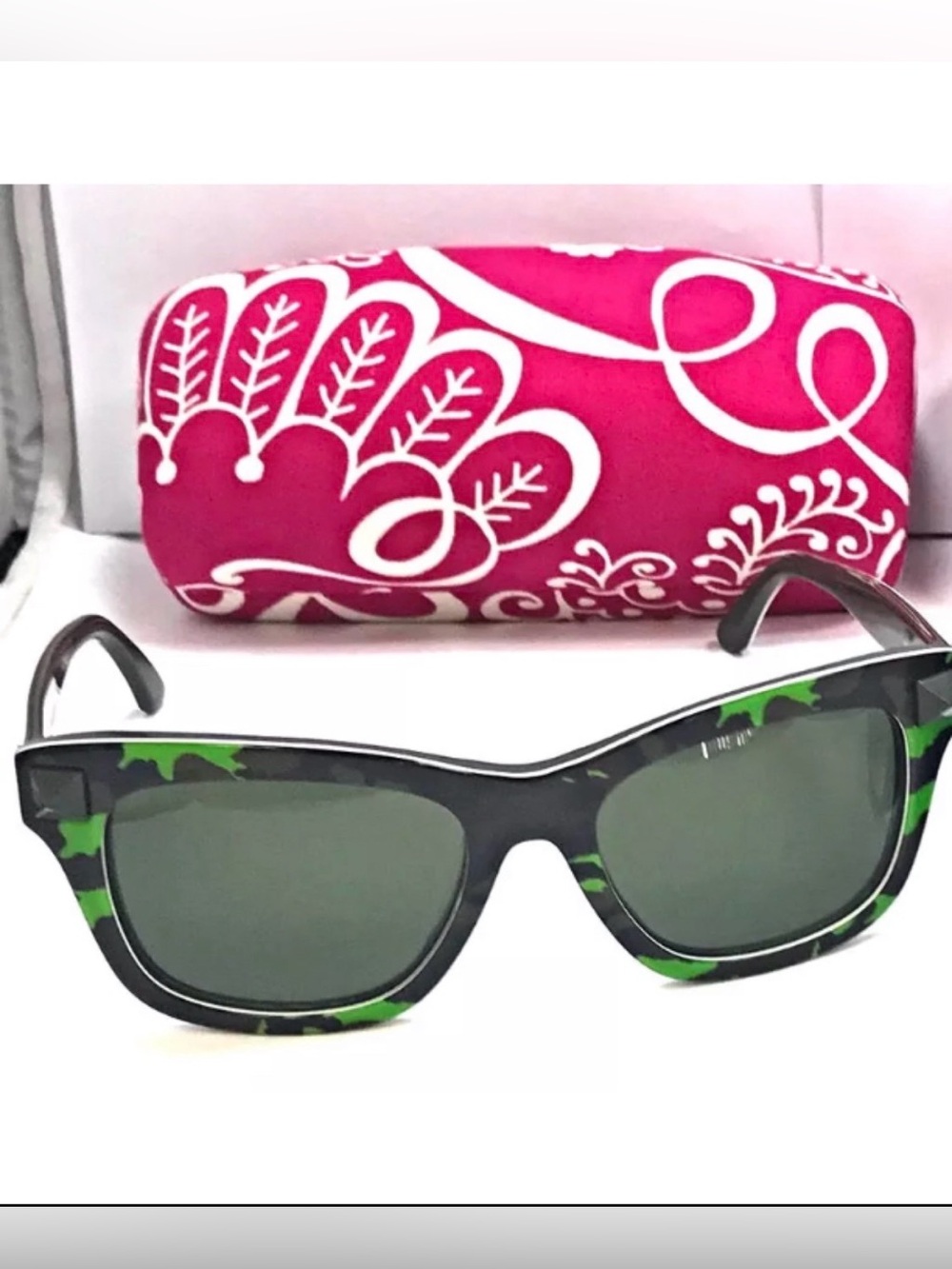 Valentino made in Italy women’s Black and Green Camo Sunglasses.